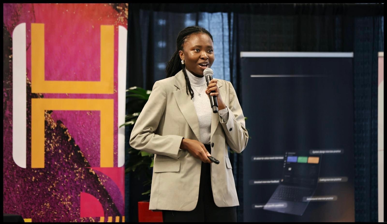 Ebun speaking at conference